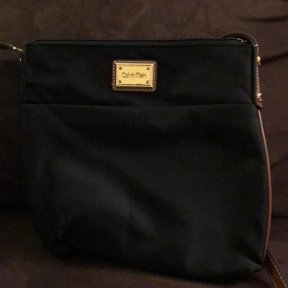 Black bag with brown leather straps